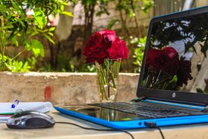 Computer and flowers