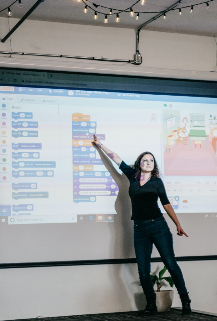 Instructor showing the piece of code on the projector screen