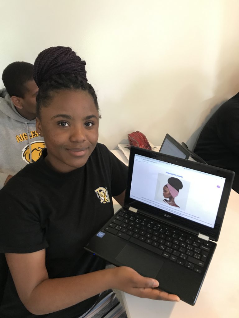 girl presenting project on laptop