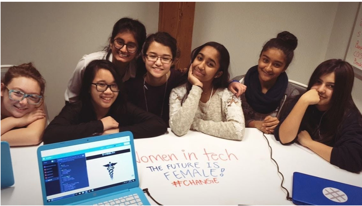 Girls working on a women in tech project