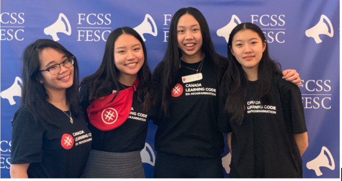 Group of teen girls in front of a purple banner. Build your local computer science community and your resume. Apply for Canada Learning Code’s teen ambassador program today.