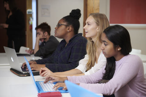 Four people on laptops